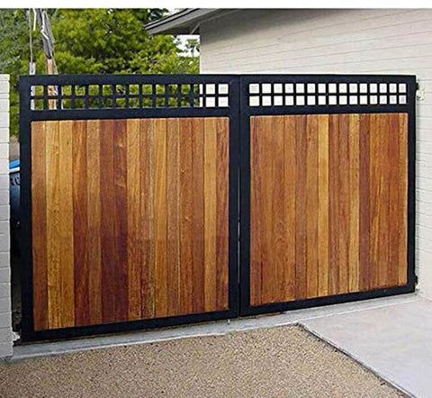 Wooden sliding gate with black metal frame in a residential driveway, demonstrating durable, rust-resistant performance.