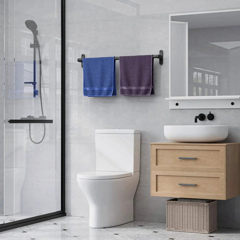 Matte Black 24 Inch Wall Mounted Towel Rack With Rustproof Aluminum Construction in a modern bathroom setting with towels