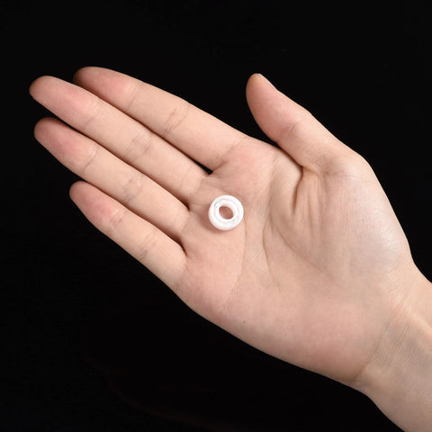 R188 full ceramic bearing, zirconia (ZrO2), 1/4 x 1/2 x 3/16 in, small white bearing in palm