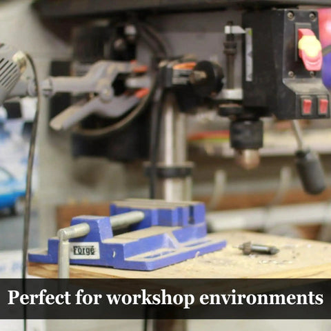 Workshop with tools, drill press and vise visible in foreground, indicating potential use for Eco Friendly Multipurpose Lubricant Spray.