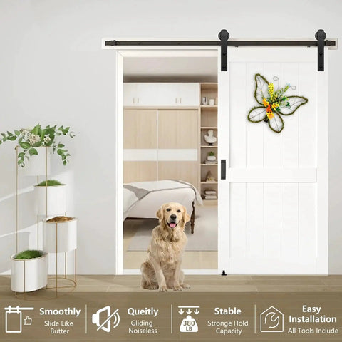 White interior room with sliding barn door hardware kit 6.6 ft heavy duty for smooth quiet operation installed, dog sitting in doorway.