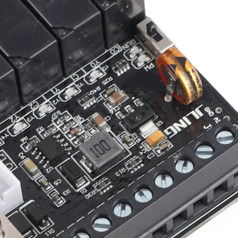 Close-up of DC24V PLC Controller Kit With Relay Output For Industrial Automation FX1N 14MR Module Programmable Logic Controller Board.