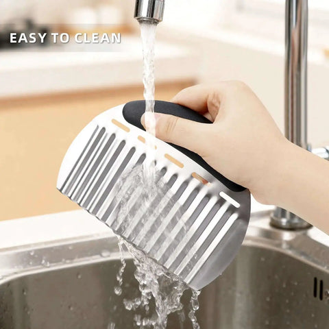 Person washing Stainless Steel Potato Crinkle Cutter And French Fry Cutter Large Wavy Slicer under tap, showing easy cleaning.
