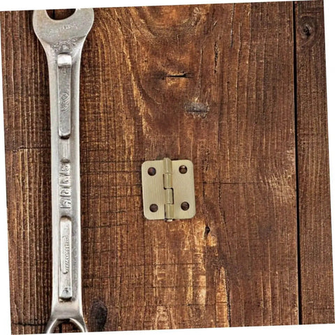 Mini Jewelry Box Hinges Set With Screws 40 Pcs 270 Degree Cabinet Hinges on wood with a wrench for size comparison.