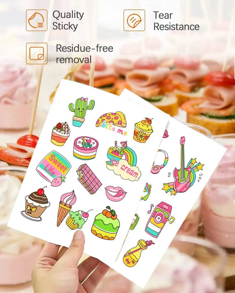 Person holding sheets of colorful stickers showing various designs. Premium Printable Vinyl Sticker Paper For DIY Crafts QYH 50 Sheets Glossy White Quick Drying Waterproof Compatible With Inkjet And Laser Printers Delivers Vivid Prints For Labels Stickers And Scrapbooking Projects.
