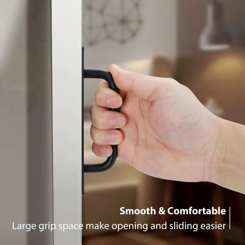 Hand gripping black barn door handle, demonstrating easy install and grip friendly Black Barn Door Handles 4 Pack With 5 Inch Hole Center Aluminum Sliding Door Pulls For Pocket Doors Bifold Closets Hardware Replacement Durable Rust Resistant Grip Friendly Easy Install