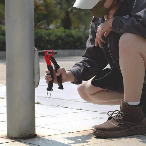 Person using 8 Inch Rivet Nut Tool Kit With 9 Metric And SAE Mandrels, 90 Rivnuts, for automotive or DIY project on metal pole.