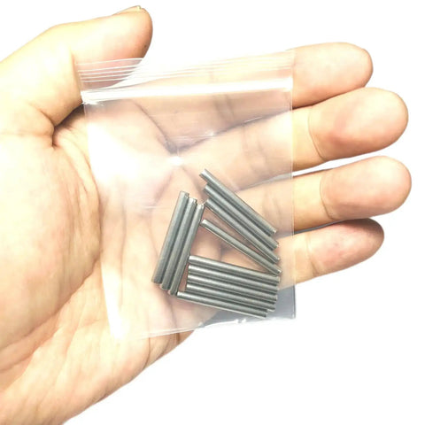 12 Pack 3mm By 30mm Dowel Pins M3 Metal Shelf Pegs For Woodworking And Furniture Stainless Steel 304 Ground To Precision Tolerance 0.0001 To 0.0005 Inch Built Tough For Shelves Bunk Beds And DIY Projects in a person's hand