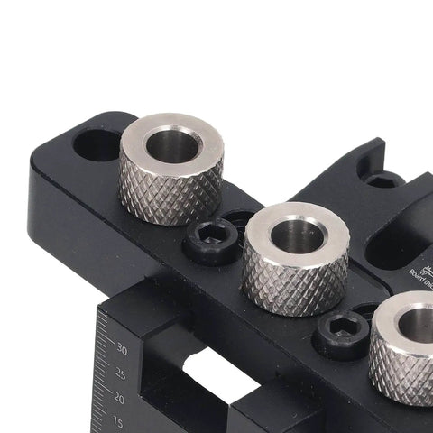 Close-up of Three In One Pocket Hole Jig Kit for Woodworking Aluminum Alloy Round Dowel Drill Guide showing brass locators.