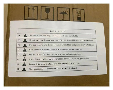 Brown cardboard tool box with a white multilingual warning label on top showing warning icons and text.
