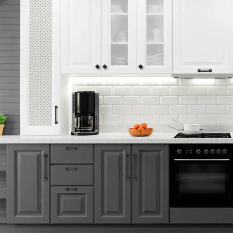 Modern kitchen with 30 Pack 5 Inch Center Black Matte Cabinet Pulls Arch Style Drawer Handles on gray and white cabinets.