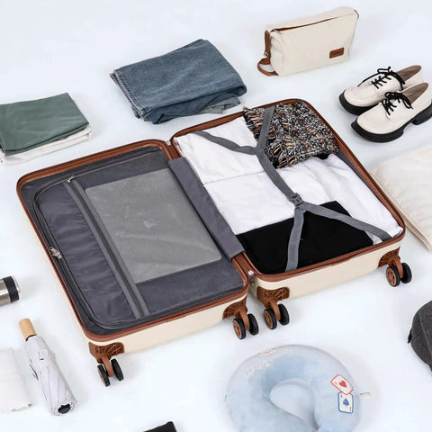 Open suitcase from Five Piece ABS Luggage Set With Spinner Wheels And TSA Lock, containing clothes and travel accessories, displayed with duffel bag and shoes nearby.