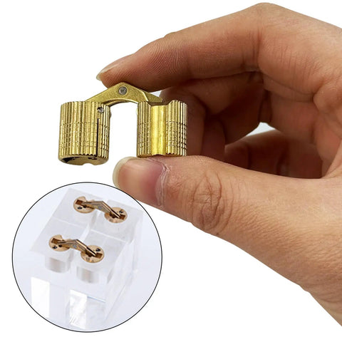 Person holding 10Pcs Brass Hidden Barrel Hinges For Jewelry Boxes And Small Cabinets, 180 Degree Opening, Invisible Cabinet Hardware, M14x31mm