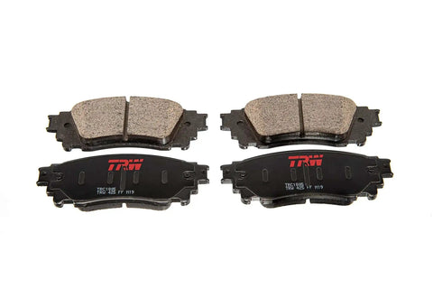 OE Quality Disc Brake Pad Set TRM0799 For Toyota Tacoma 2000 2002 Replacement, front view showing pads and backing plates