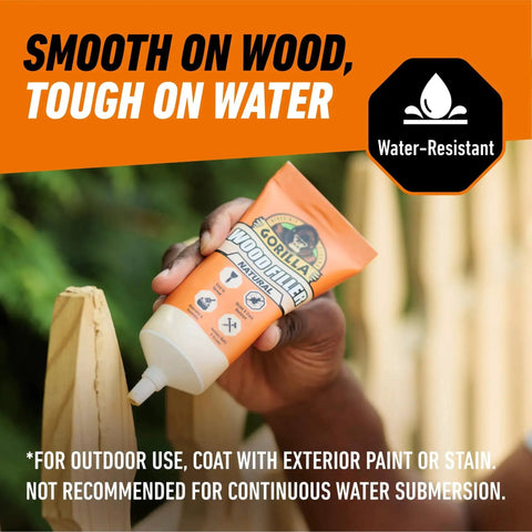 Person applying All Purpose Wood Filler Natural Color 6 Ounce Tube Pack Of 1 Water Resistant to outdoor wood surface