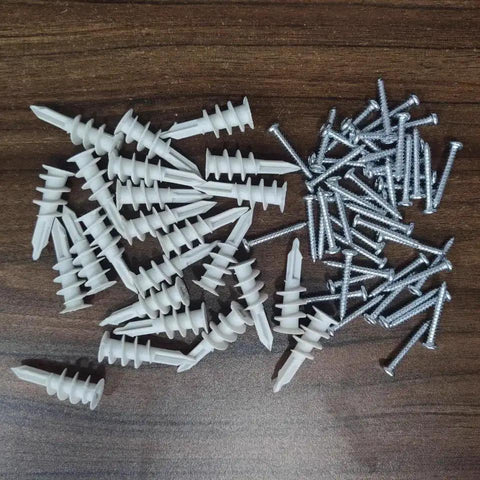 Self Drilling Drywall Anchors Set 100 Pcs with screws on wooden surface