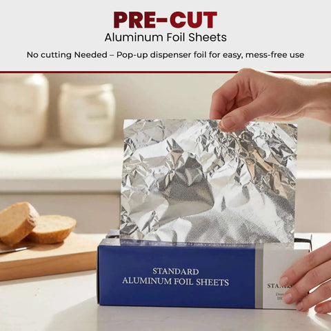 Hand pulling sheet from Heavy Duty Pre-Cut Aluminum Foil Sheets 12 x 10.75 Inches with Pop Up Dispenser for easy tear.