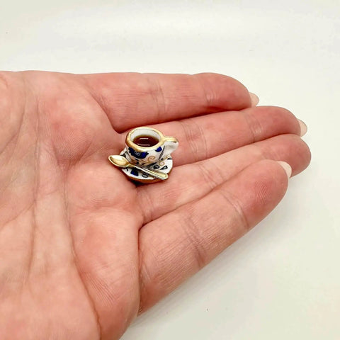 Close-up of miniature teacup hinge head from Six Pack Tea Cup Door Hinge Heads Decorative Toppers Set For Unique Home Kitchen Decor