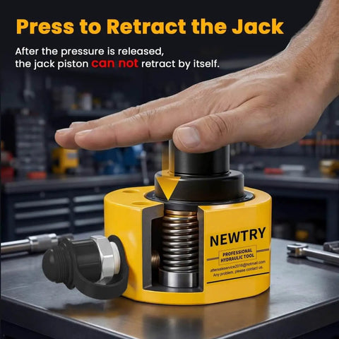 Hand pressing the top of a 20 Ton Hydraulic Ram Jack With Low Profile Design, Multi Section Lift Cylinder in a workshop setting.