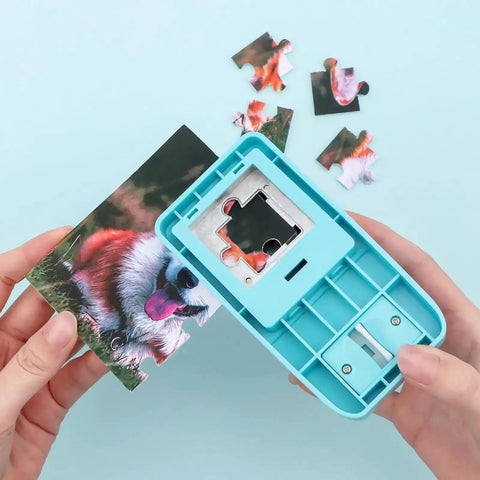 Hands using 1 Inch Puzzle Hole Puncher For DIY Jigsaw Crafts Portable Cardboard Cutter on photo to create custom puzzle pieces