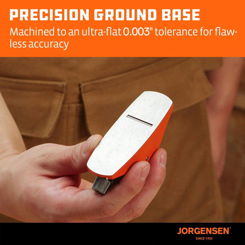 Close-up of Jorgensen No101 Mini Wood Planer for Woodworking Pro Grade Hand Plane for Trimming and Finishing held in hand.