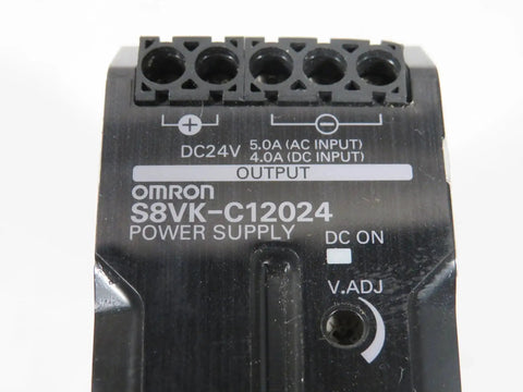 Close-up of DIN Rail Power Supply 120W 24V DC 5A Enclosed Switch Mode With Adjustable Output 100 240VAC Input Industrial Grade Used