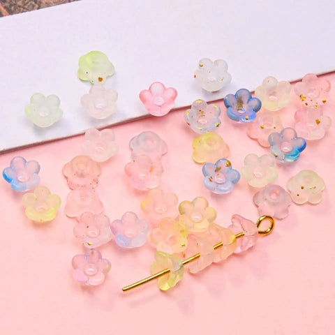 Acrylic Frosted Flower Beads Six Millimeter With Golden Speckles Matte Mini Floral Spacer Beads Bulk 1000pcs in storage box close-up