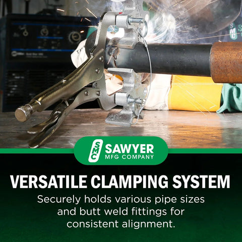 Welders 3rd Hand portable pipe welding clamp by Sawyer on steel pipe amid sparks