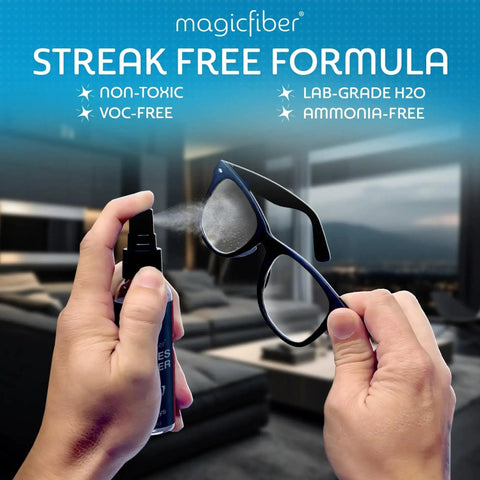 Person cleaning glasses with spray from Glasses Cleaner Kit With Two Sprays And Two Microfiber Cloths For Lenses Screens
