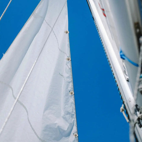 Twist Lock Fasteners Kit 25 Sets With Zinc Alloy Eyelets And Studs Marine Grade Grommets installed on sailboat canvas under blue sky