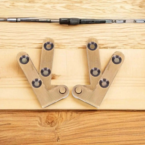 Bronze Pivot Door Hinges Set Two Pack Heavy Duty Hidden Door Hardware on wood surface