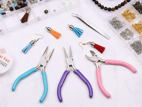 Essential 3 Piece Jewelry Pliers Set for DIY Wire Wrapping and Repairs with Needle Nose, Chain Nose, Round Nose Pliers and Wire Cutter by Shynek on a workspace.