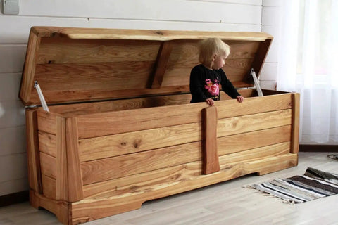 Child sitting in wooden chest showing 2 Pack 150N Gas Strut Spring Hinges For Heavy Lids That Stay Put With Soft Close And Slow Down Hydraulic Lid Supports.
