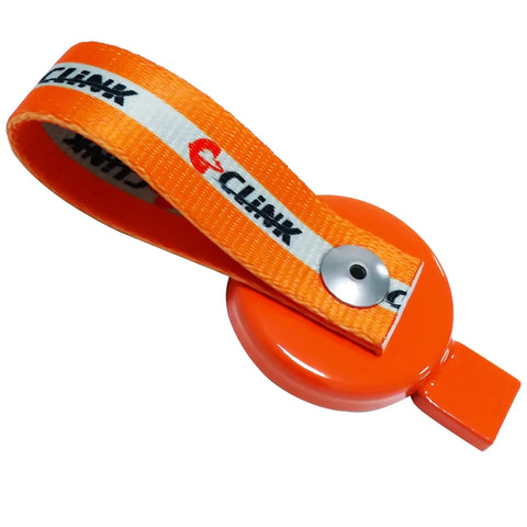 Close-up of orange two-piece C CLINK lockout key with magnetic strap for UFP surge brakes on a boat trailer