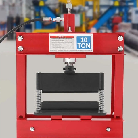 12-Inch Press Brake Attachment For 12 To 20 Ton Hydraulic Shop Press, shown installed on a red 10-ton press in workshop setting