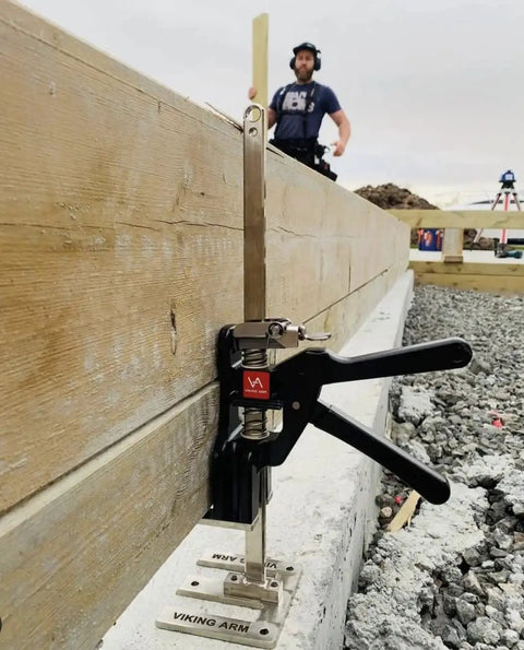 Side view of Original Handheld Jack and Clamp for One Hand Lifting Up to 330 Lbs installed on wooden beam.