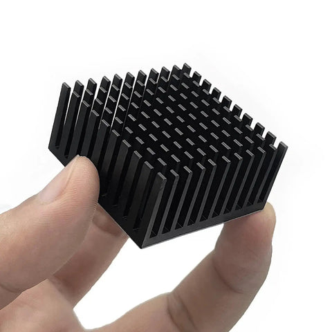 Close-up of 4 Pack Aluminum Heat Sink 40x40x20mm with Thermal Conductive Tape, held in hand, black color, used for VRM GPU Router applications