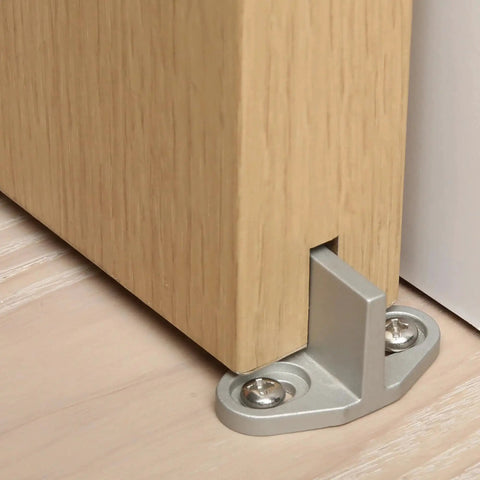 Sliding Barn Door Bottom Floor Guide With T Shape Design, silver, installed on wood floor, stabilizing wooden door.