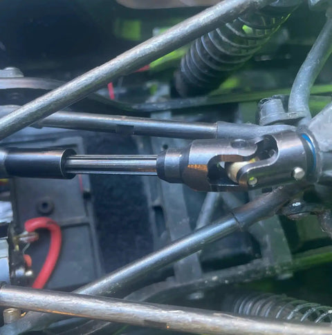 Close-up of Two Pack Internal Spline RC Driveshaft 121-190mm installed in a 1/10 scale crawler with steel universal joint.