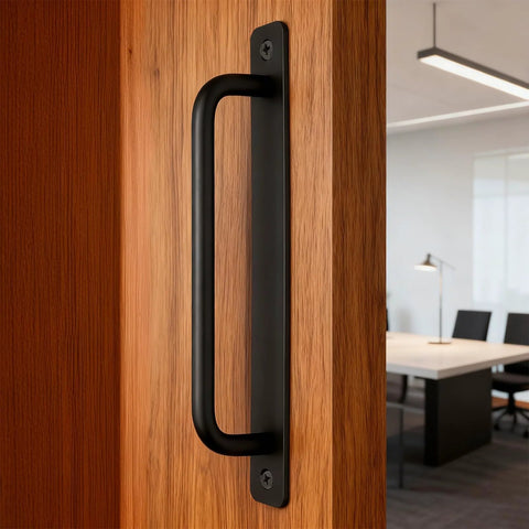 Side view of Two Pack Sliding Barn Door Handle With Plate, 7 Inch Aluminum Alloy Door Pull, Black Finish, installed on a wood door.