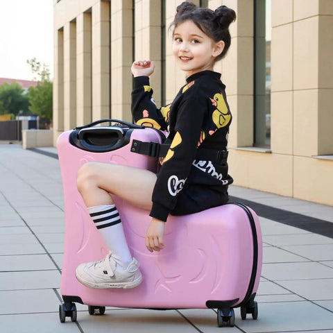 Kid sitting on pink Kids Ride On Suitcase With Wheels For Travel For Toddlers And Children Ages Two To Fifteen Easy Rolling Luggage