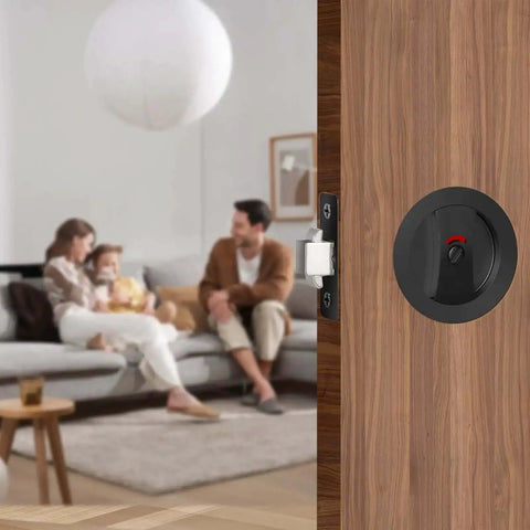 Matte Black Pocket Door Lock Set with Privacy Indicator for sliding and pocket doors shown installed on a wooden door.