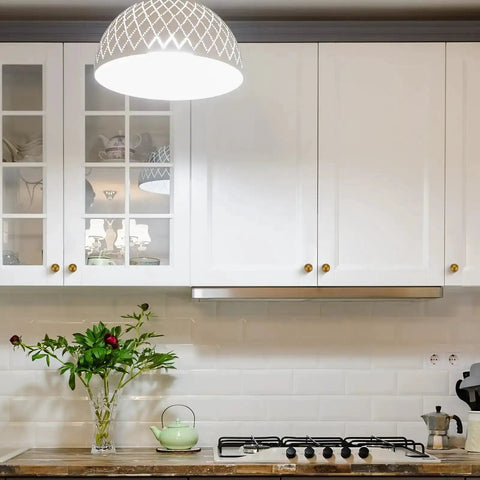 Modern kitchen with cabinets featuring Antique Brass Round Cabinet Knobs 6 Pack, 0.95 inch diameter, zinc alloy construction.