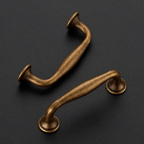 Antique Brass 3 Inch Cabinet Handles Set Of 5 In Solid Zinc Alloy for kitchen cabinets and drawers, shown in smooth edges, top view.