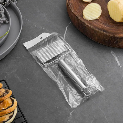 Two Pack Stainless Steel Ripple Potato Slicer And Crinkle Cutter For French Fries And Veggie Cutting Kitchen Gadget For Home And Restaurant Use With Easy Grip Handle And Pro Grade Durable Metal Construction in packaging on countertop
