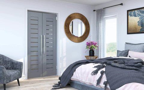 Bedroom with modern decor featuring double doors and stylish furniture.