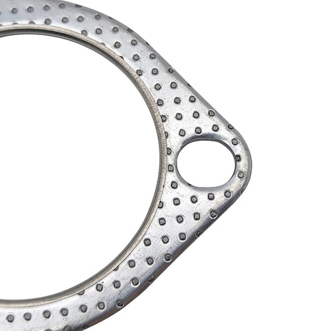 Exhaust gasket ring close-up, silver metal with a dimpled surface and mounting tab with bolt hole.