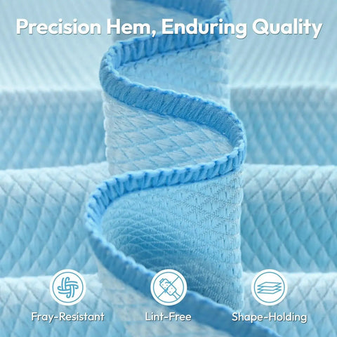 Close-up of blue diamond pattern microfiber cloths showcasing precision hem, focus on lint-free and shape-holding features.