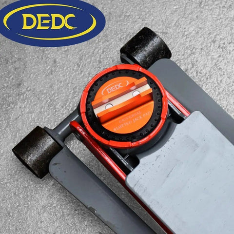 Aluminum Grooved Magnetic Jack Pad Pinch Weld Frame Rail Adapter For Cars installed on a vehicle jack, showing red and orange details.