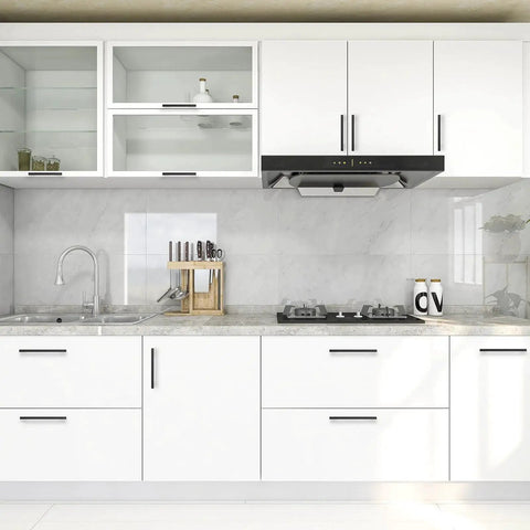 Modern kitchen with white cabinets featuring 3 pack black cabinet pulls 3.75 inch hole center wide foot drawer pulls for cabinets.